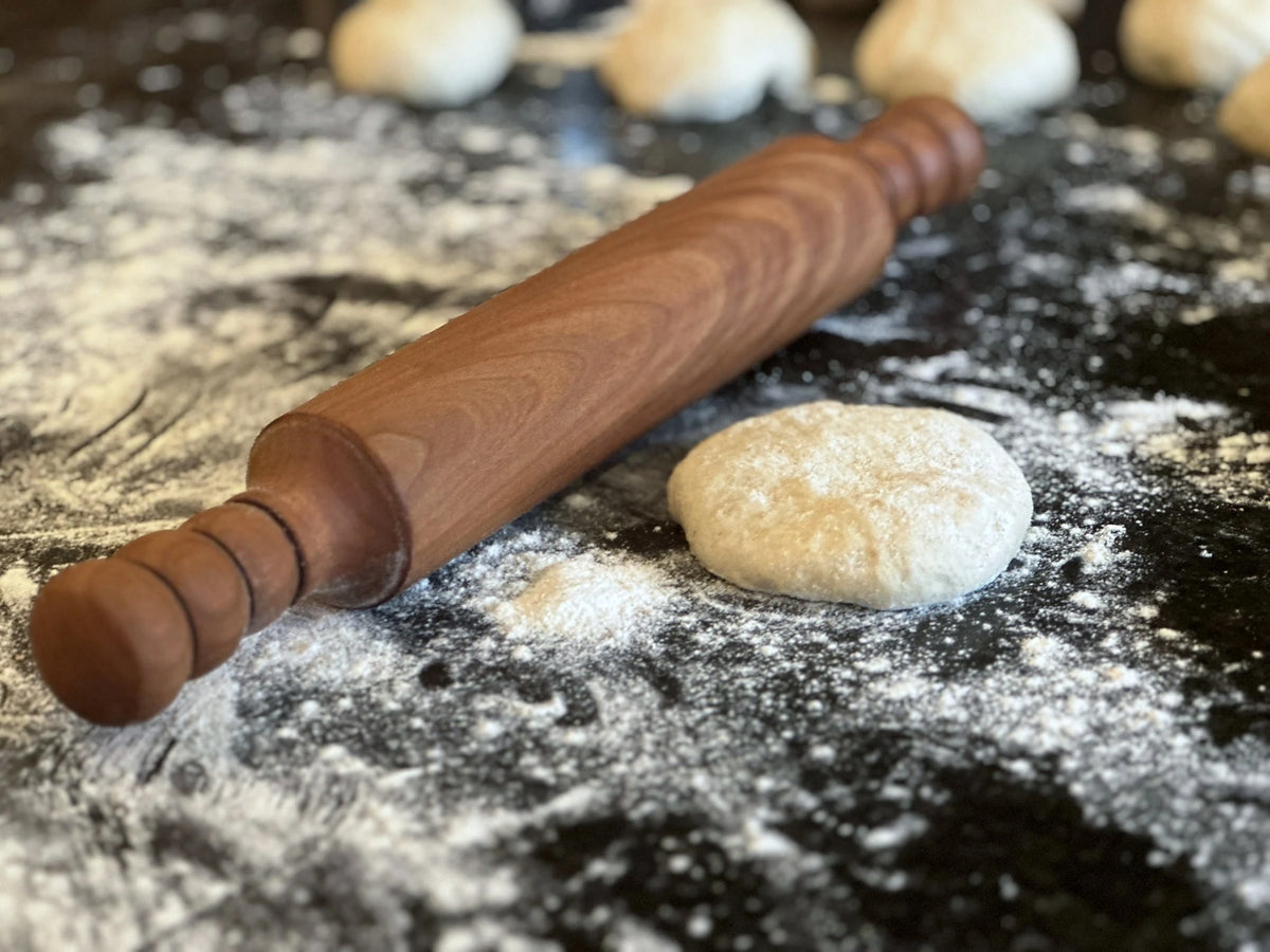 Handcrafted wooden rolling pin in use