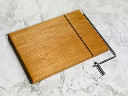 Cheese slicer showing its stainless steel cutting wire