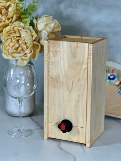 Wooden box wine dispenser showing the natural wood grain