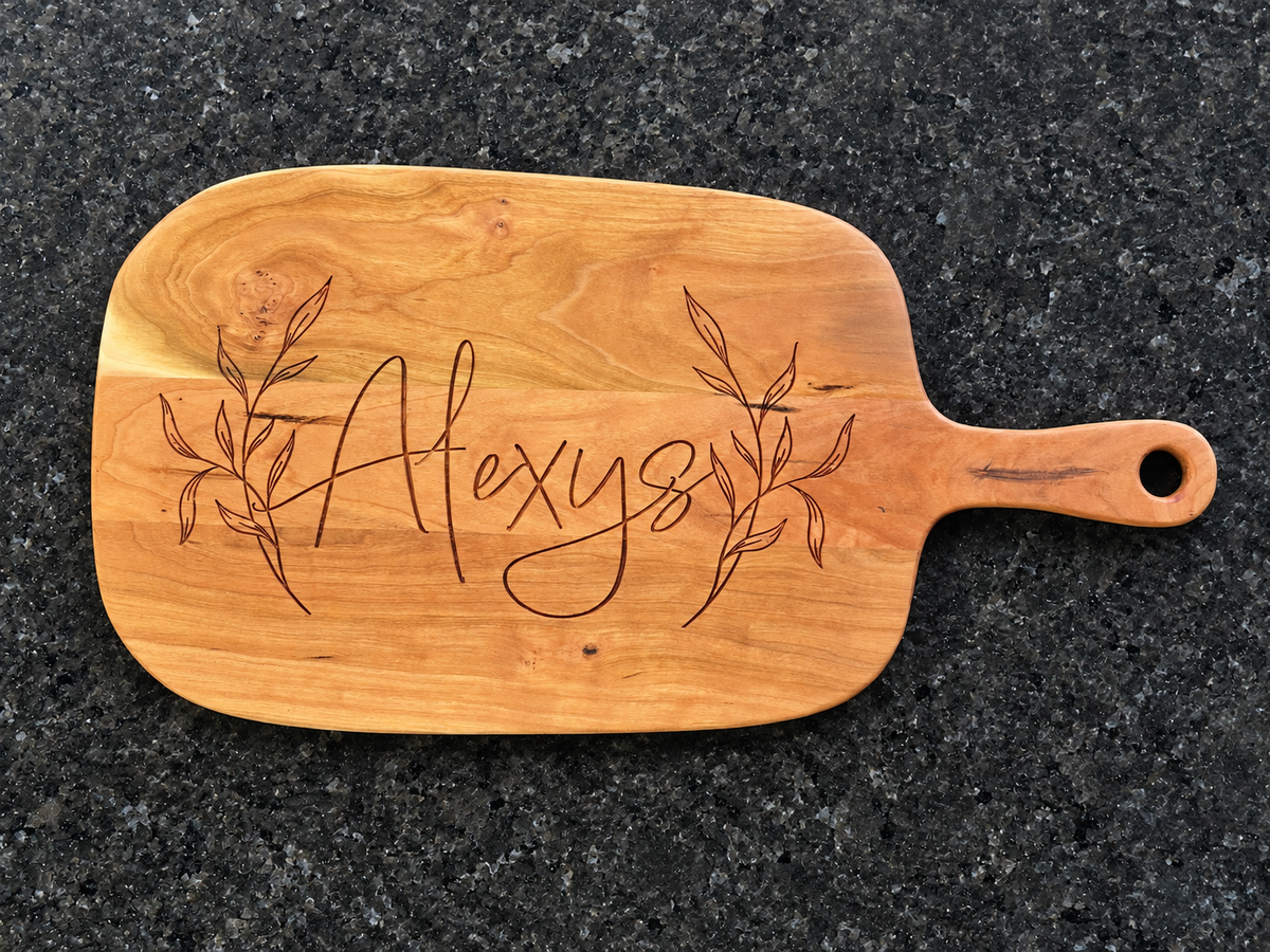 Personalized engraved wooden board with leafy design